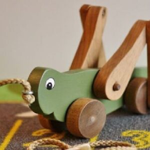 Real photo of Georgie the Grasshopper wooden pull-along toy from Kids Kits.